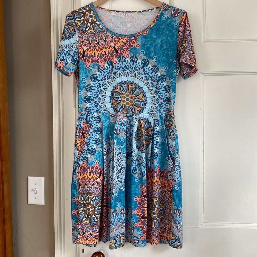 Cute print knit dress with pockets, size medium.